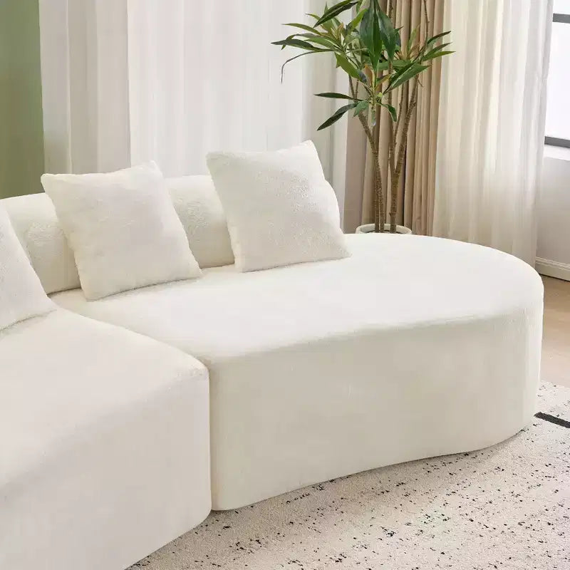 Canapé en flanelle courbé, moderne et simple. Multicolore créatif pour le salon, avec une combinaison de coussins.