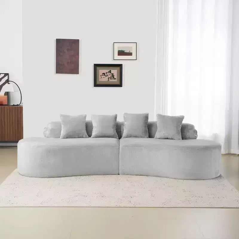 Canapé en flanelle courbé, moderne et simple. Multicolore créatif pour le salon, avec une combinaison de coussins.