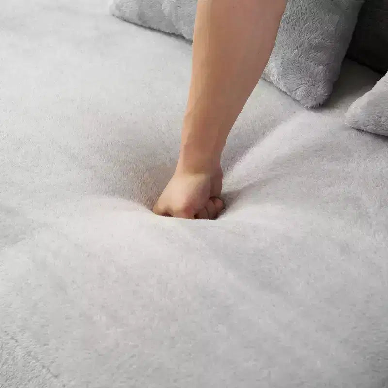 Canapé en flanelle courbé, moderne et simple. Multicolore créatif pour le salon, avec une combinaison de coussins.