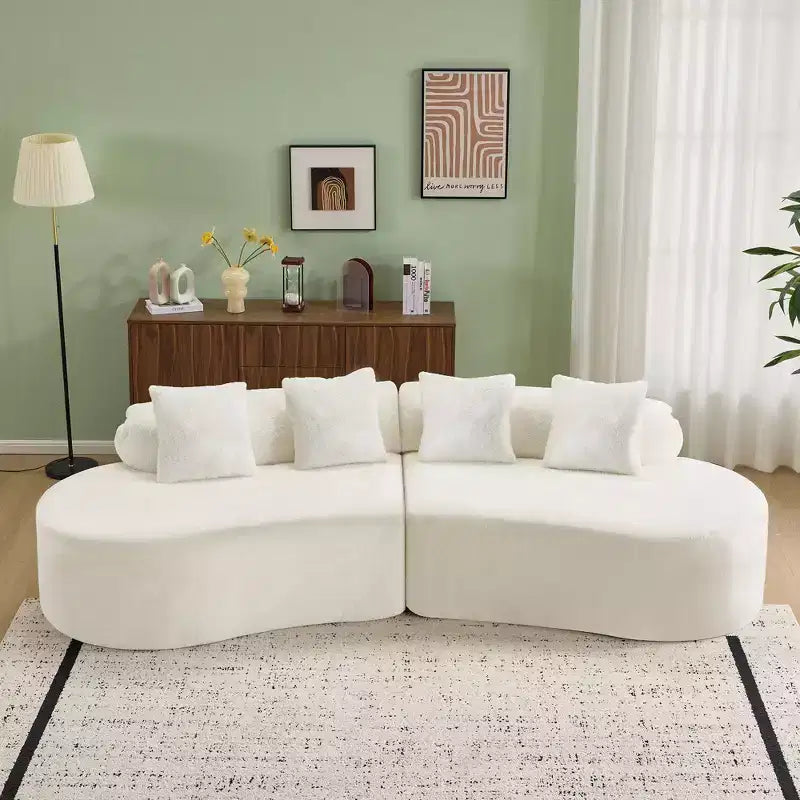 Canapé en flanelle courbé, moderne et simple. Multicolore créatif pour le salon, avec une combinaison de coussins.