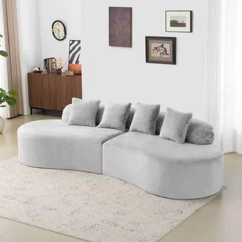 Canapé en flanelle courbé, moderne et simple. Multicolore créatif pour le salon, avec une combinaison de coussins.